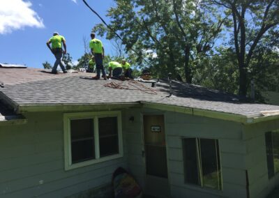 A group of people repairing roof