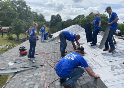 Our volunteers at the roof cleaning